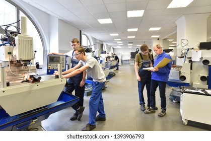 Group of young people in technical vocational training with teacher  - Shutterstock ID 1393906793