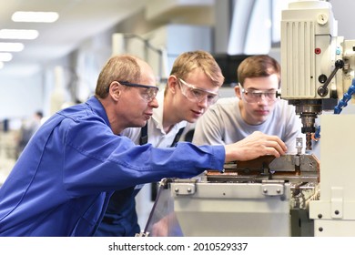 Group of young people in technical vocational training with teacher  - Shutterstock ID 2010529337