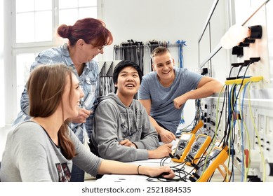 Group of young people in technical vocational training with teacher  - Powered by Shutterstock