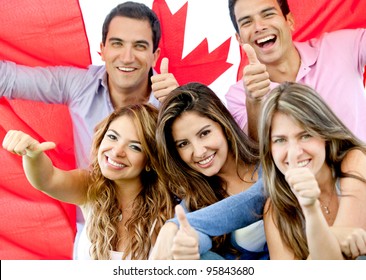 Group Of Young People With Thumbs Up And The Flag Of Canada
