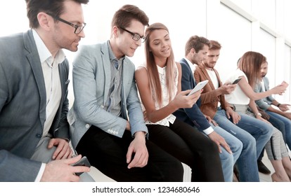 group of young people use their smartphones - Powered by Shutterstock