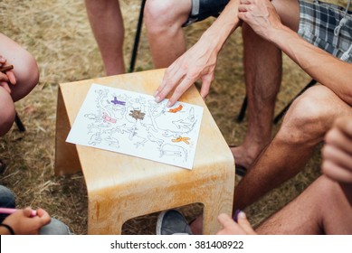 A group of young people working on a project outdoors non-formally - Shutterstock ID 381408922