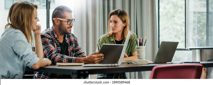 Group Of Young People Working Together. Creative Business People In Modern Office. Hipster Team In Coworking. Young Modern Colleagues. Teamwork.