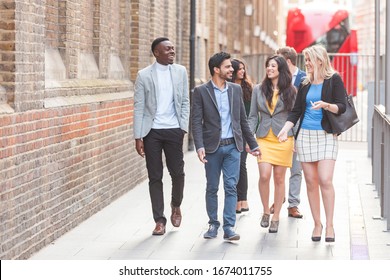 Group Of Young Professional Walking In The City - Business Multiracial Group In London, Smiling And Talking During A Break Walk From Office Job