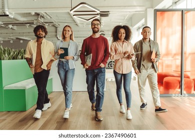 Group of young smiling multiracial business people, colleagues walking in modern office, successful business, career concept. Portrait happy students looking at camera in university campus, education - Powered by Shutterstock