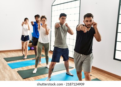 Group Of Young Sporty People Concentrate Boxing At Sport Center.