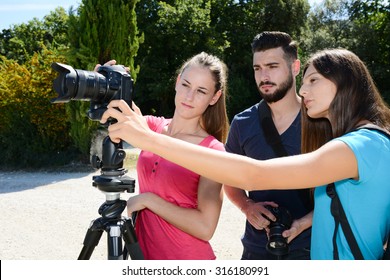 Group Of Young Student Photographer Taking Pictures On Photography Shooting Workshop Course Outdoor