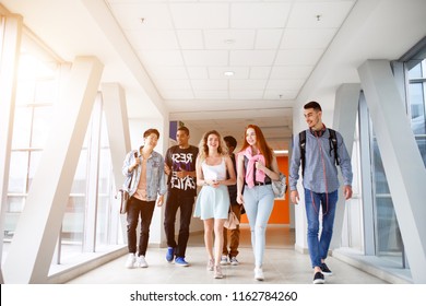 A Group Of Young Students From Different Countries Go To Classes. The Photo Illustrates Education, College, School, Or University.