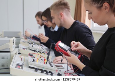 Group Of Young Students In Technical Vocational Training With Teacher, The Lesson In Technical College. Education And Technology Concept.