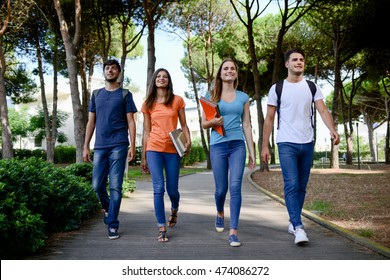 Group Of Young Students Walking Together In A High School University Campus