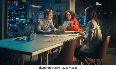 Group of Young Successful Businesspeople Making a Team Meeting in Conference Room in Creative Agency. Excited Diverse Team Discussing a New Digital Marketing Plan. - Powered by Shutterstock