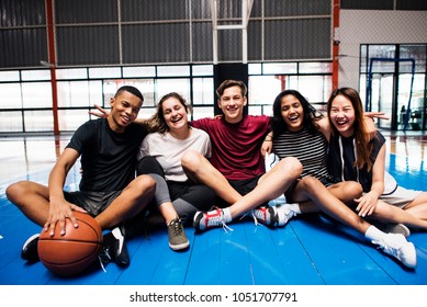 Group of young teenager friends on a basketball court relaxing portrait - Powered by Shutterstock
