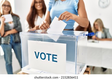 Group Of Young Voter Woman Smiling Happy Putting Vote In Voting Box At Electoral Center.