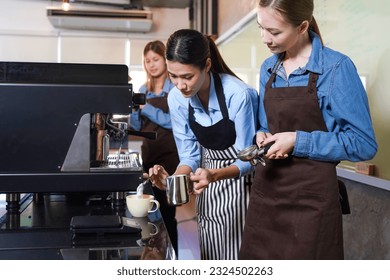 Group young woman people leaning and education workshop for classes barista coffee in cafe room.  Preparing teacher meeting and training service about hospitality and make coffee.  Education Concept - Powered by Shutterstock