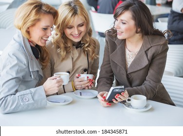 Group Of Young Women Drinking Coffee