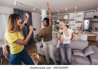 Group Of Young Women Spend Free Time In Karaoke, Sing And Have Fun Together, With Friends, At Home.