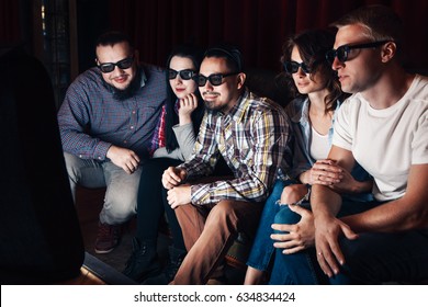 Group Of Youth Watching New Movie In 3d Glasses At Home. Five Young Friends Have Fun Sitting On Couch In Front Of Tv For Entertainment.