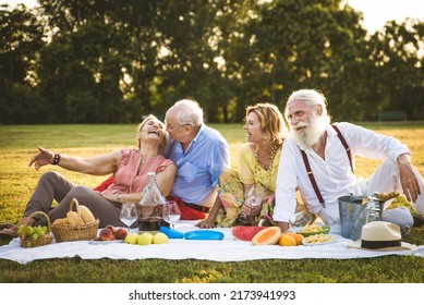 Group Of Youthful Seniors Having Fun Outdoors - Four Pensioners Bonding Outdoors, Concepts About Lifestyle And Elderly