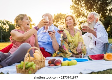 Group Of Youthful Seniors Having Fun Outdoors - Four Pensioners Bonding Outdoors, Concepts About Lifestyle And Elderly