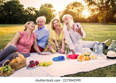 Group Of Youthful Seniors Having Fun Outdoors - Four Pensioners Bonding Outdoors, Concepts About Lifestyle And Elderly