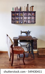 A Grouping Of Antique Sewing Equipment In A Room