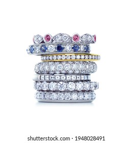 grouping of color gemstone rings with colored diamonds and gemstones on white background - Shutterstock ID 1948028491