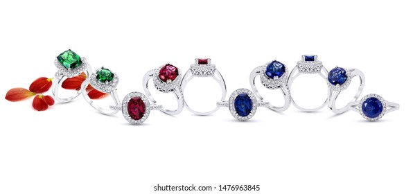 Grouping Of Color Gemstone Rings Jewelry With Colored Diamonds  On White Background And Petal