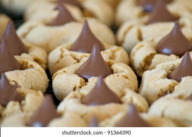 A grouping of peanut butter cookies with chocolate kisses