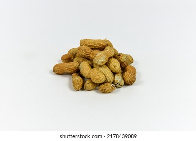 A Grouping Of Peanuts On A White Background. Food, Salary, Thought Provoking Concepts.