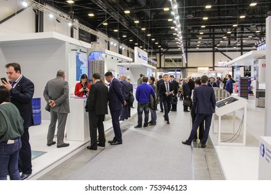 Groups of business people among company stands.
St. Petersburg, Russia - 3 October, 2017.
Participants and visitors of the annual St. Petersburg Gas Forum.