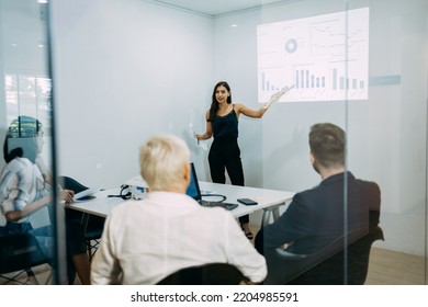 Groups Of Business People Diverse Meeting Presentation Charts And Business Reports Together On The Board In The Office, Planning Strategy New Marketing Projects, And Teamwork Concepts.