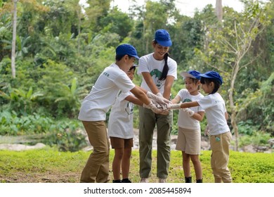 Groups of children and teachers join hands to work together to protect the environment, Save environment planet, Volunteer team. - Powered by Shutterstock