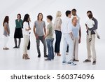 Groups of different people standing randomly and talking.