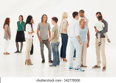 Groups of different people standing randomly and talking.