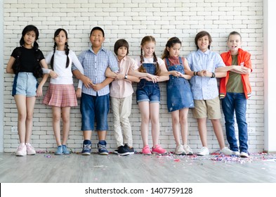 Groups of elementary school children standing in the classroom. - Shutterstock ID 1407759128