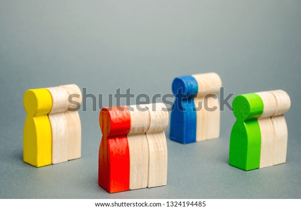 Groups of multicolored wooden people. The concept\
of market segmentation. Target audience, customer care. Market\
group of buyers. Customer analysis, customer relationship\
management. Selective\
focus