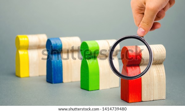 Groups of multicolored wooden people. The concept\
of market segmentation. Target audience, customer care. Market\
group of buyers. Customer analysis, customer relationship\
management. Selective\
focus