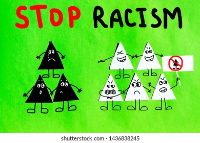 Groups of papers triangles on green background. Concept of stop racism