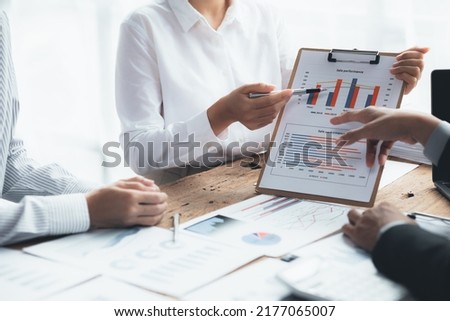 Groups of people pointing to sales documents, business meetings, startup company sales team meetings, brainstorming and sales performance summaries. Sales management concept of the department.
