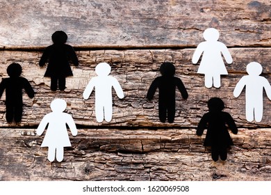 Groups Of White And Black Silhouettes On Wooden Background Anti Racism Concept