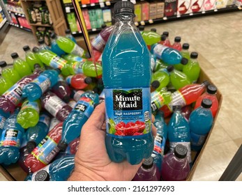 Grovetown, Ga USA - 05 20 22: Retail Store Hand Holding Minute Maid 20 Ounce Drink Blue Raspberry