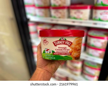 Grovetown, Ga USA - 05 26 22: Retail Store Turkey Hill Ice Cream Hand Holding Orange Cream Swirl