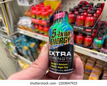 Grovetown, Ga USA - 06 17 22: Retail Grocery Store Hand Holding 5 Hour Energy Drink Extra Colorful