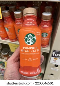 Grovetown, Ga USA - 08 18 22: Retail Grocery Store Starbucks Pumpkin Spice Latte Bottle In Hand