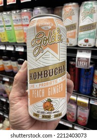 Grovetown, Ga USA - 09 07 22: Hand Holding Retail Grocery Store Golda Kombucha Can Drink