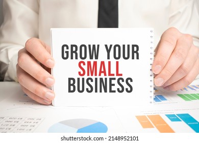 Grow Your Small Business. text on paper on craft envelope on white background
