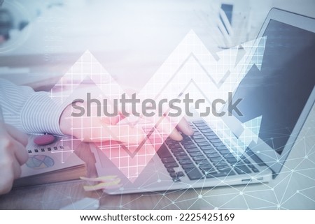 Growing arrows with businessman working on computer on background. Success concept. Double exposure.