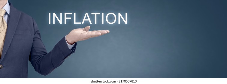 Growing Inflation Concept. Businessman Showing Word Inflation. Rising Inflation Due To Global Economic Crisis. Putin Price Hike. Wide Blue Banner. Copy Space