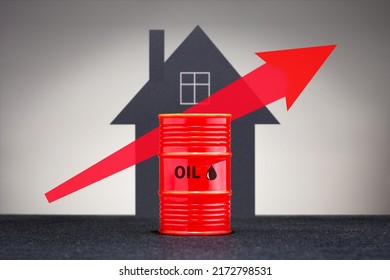 Growing Oil Prices Concept. Barrel With Heating Fuel On The Background Of House. 