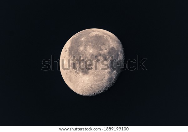 Growing phase moon in dark\
sky